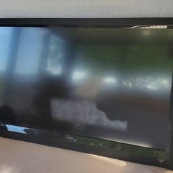 42" VIZIO TV, IT COMES WITH THE REMOTE CONTROL BUT DOESN'T HAVE THE STAND. IT DOES COMES WITH A WALL MOUNT. IT'S STILL IN GOOD CONDITION. NOT A SMART 
