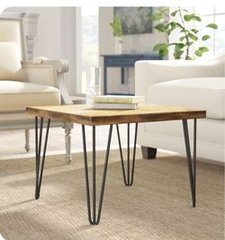 Solid wood small coffee table with metal legs. About 30” wide