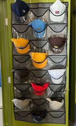 two large  hanging storage organizers- sold together- one for caps, etc one for misc. New