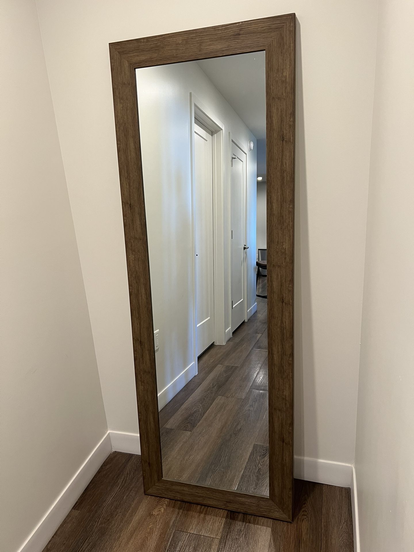 decorative mirror with a wooden frame