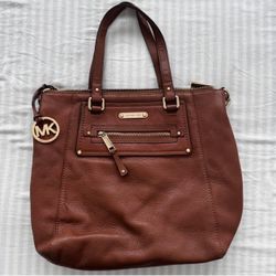 Brown Michael Kors genuine leather bag with top handle and cross body strap 