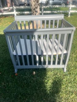 Gray Wooden Mini Crib With Mattress – $40