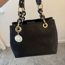 Black Michael Kors purse with hand strap and sholder straps