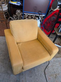 Natuzzi yellow armchair