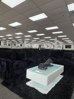 Elevate your living space with this Luxurious black sectional