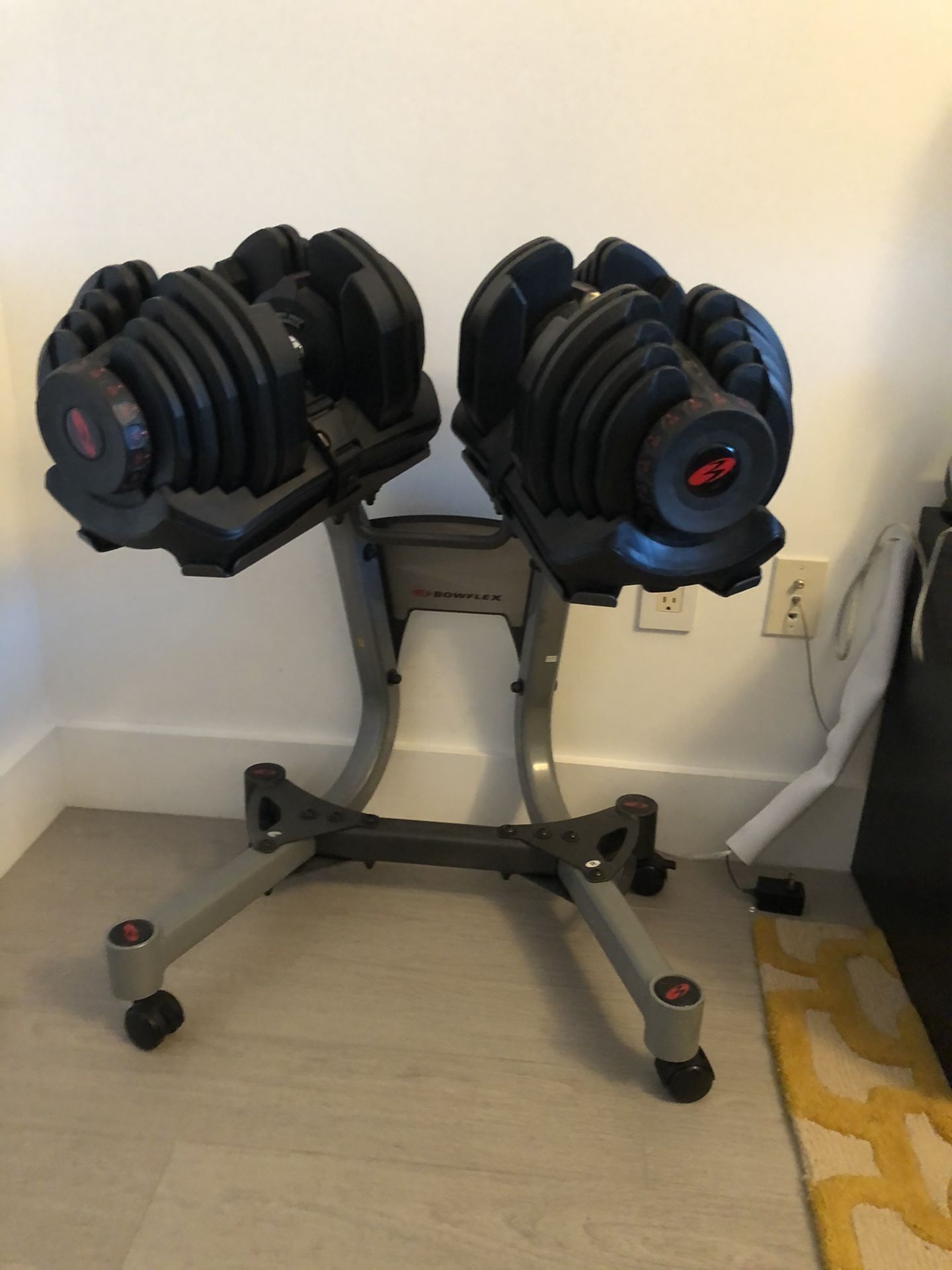 Bowflex adjustable dumbbells 10 to 85 pounds with stand