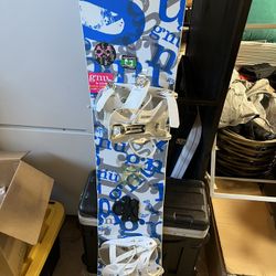 Snowboard With Dakine Cover 