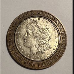 Encased is a authentic 1889 silver dollar surrounded by a Buick advertising outer ring that says it’s the best Buick yet