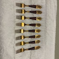 Set of eight vintage Siam Buddha brass and wood appetizer forks