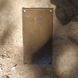 Is 100-year-old solid brass main plate from 200 horsepower Alice Chalmer's motor.