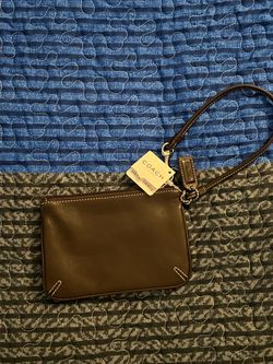 Vintage Coach brown leather wristlet with silver hardware