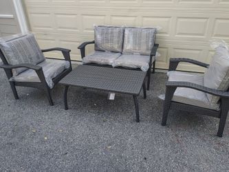 Outdoor patio wicker loveseat with chairs and coffee table