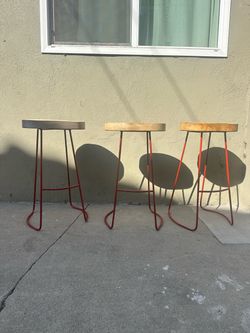 Set of 3 red wood and metal bar stools