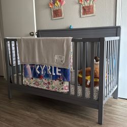 grey crib