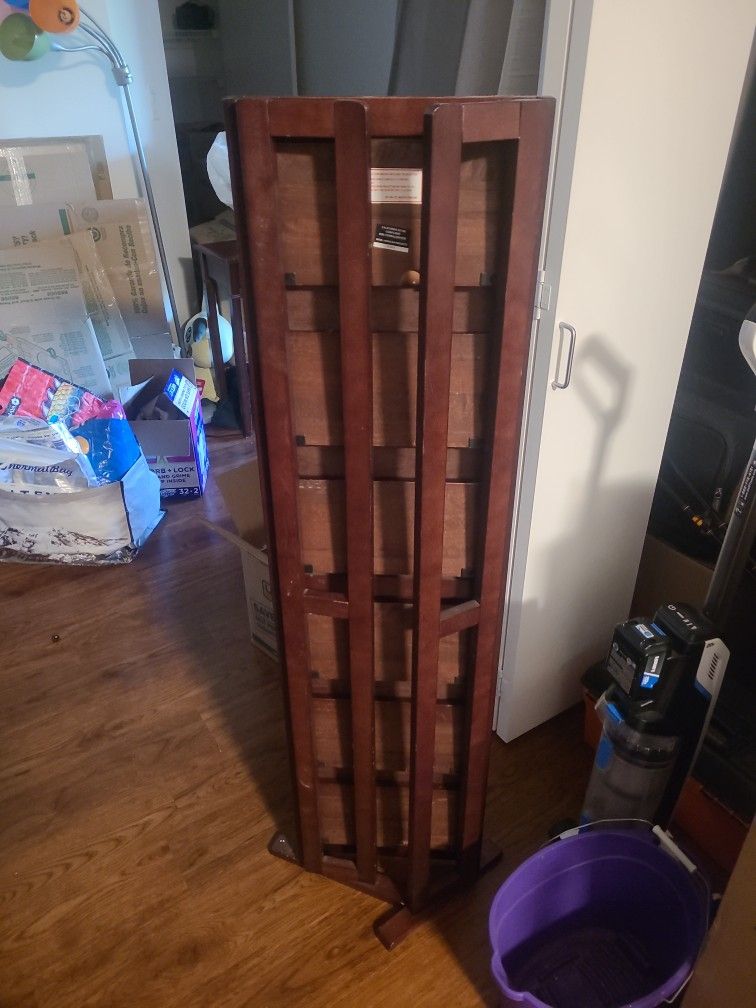 Folding DVD shelf