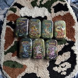 Pokémon Prismatic Evolution Tins