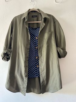 Green shirt with polkadot navy tank