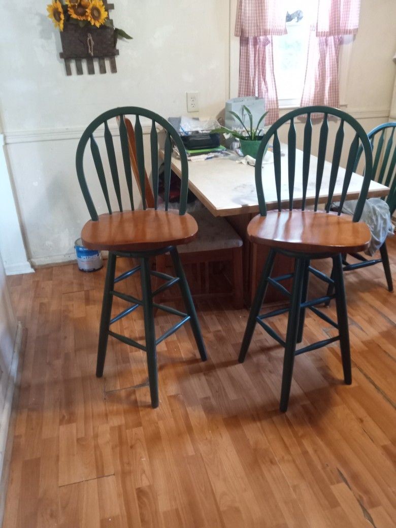 Two Wooden Swiveling Bar Stools