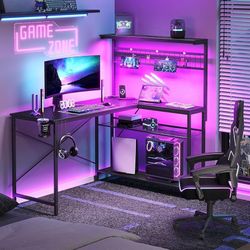 N200-Gaming Desk 51" L-Shaped, with Power Outlets & LED Lights- 4 Tier Shelves, Reversible Gamer Table with Hooks & Cup Holder for Home Office Carbon 