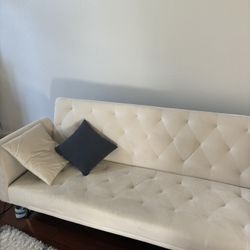 white couch that folds in a bed