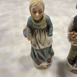 Vintage lady carrying a basket of grapes