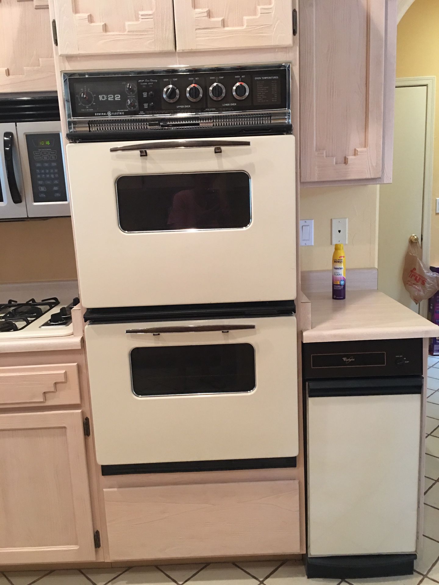 GE double oven, magic chef has cook top, Whirlpool trash compactor, light beige