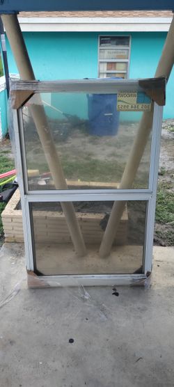 Exterior aluminum new hurricane 🌀 impact window Dusty sitting in storage approximately 37 by 56