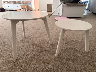 Set of two white round table