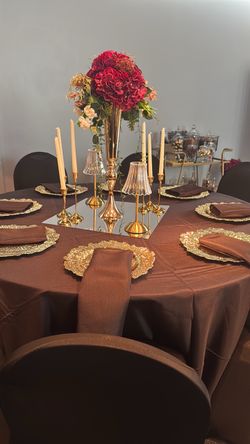 12 flower centerpieces with tall, metal trumpet vase
