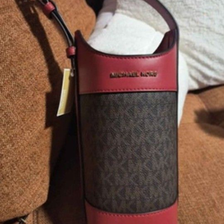 Michael Kors Wine Bottle Holder Bag Luggage Multi 100% Authentic Michael Kors !!  Details: • Leather /Coated Canvas Color  Luggage Multi • Brand New