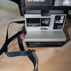 Polaroid Sun 600 LMS Camera With A Strap. Still Has Film In It, But Its Old, They Still Make It