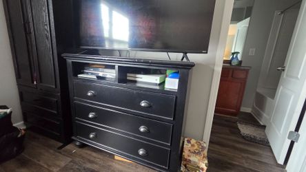 Two nightstands and tv stand with drawers.