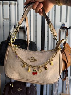 Coach purse with charms