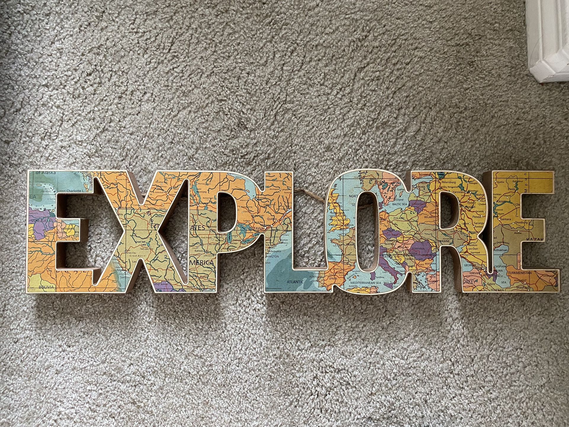 EXPLORE sign (also selling World Map)