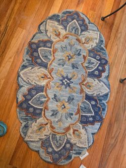 Pier1 Imports rug
Blue, cream and tan 
45" x 27"