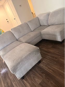 Light Gray sectional with Ottoman