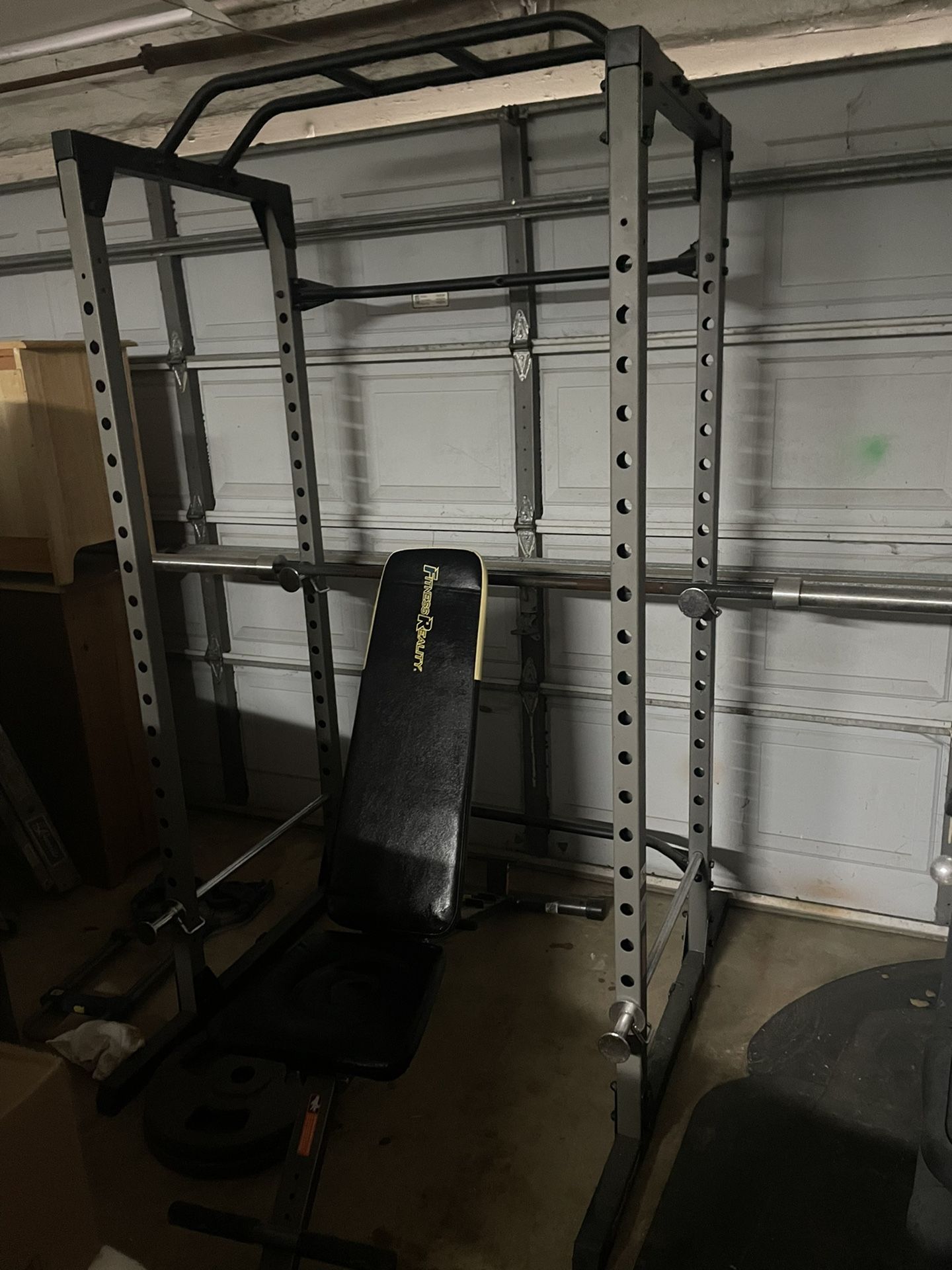 Weight Rack with Weighted Plates and Adjustable Bench