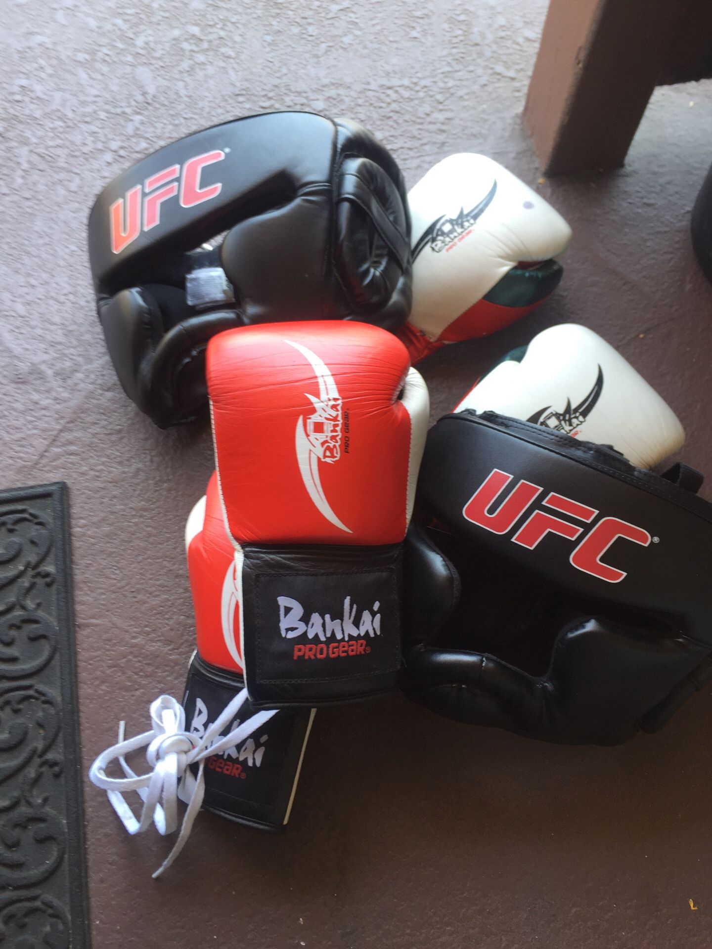 Two pair of boxing gloves and headgear S/M