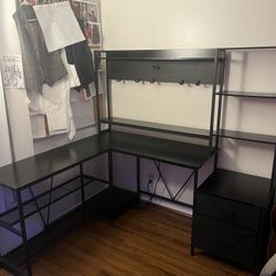 L Shape desk with Peg Board/shelves/outlet/plug