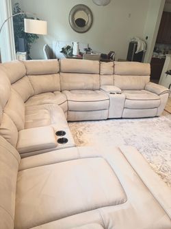 7 piece Dove Gray Sectional with power recliners, chaise, cup holders