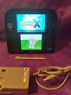 Nintendo 2-DS portable gaming system that comes with Pokemon X