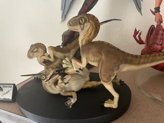 Chronicles baby raptor statue
