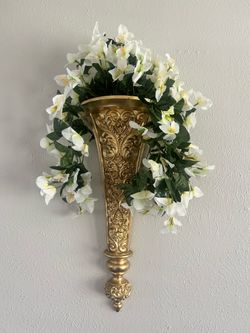 Two wall sconces with flowers