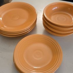 11 piece fiestaware Orange 4 dinner plate, 3 salad plates 4 bowls
