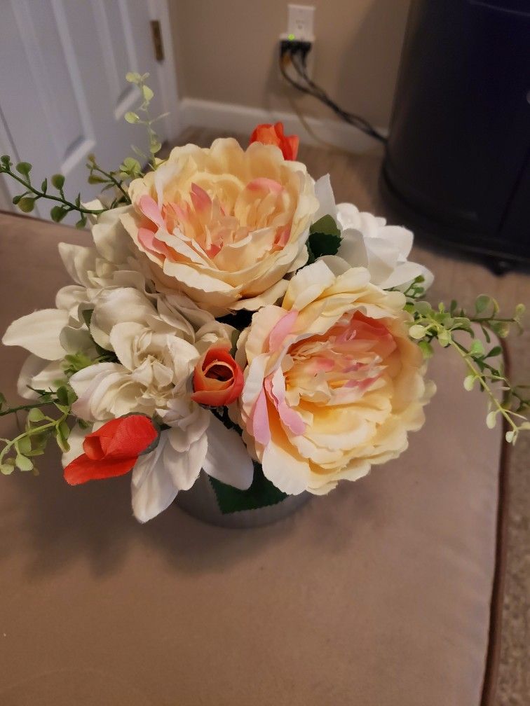 peonies flower arrangementin tin $8