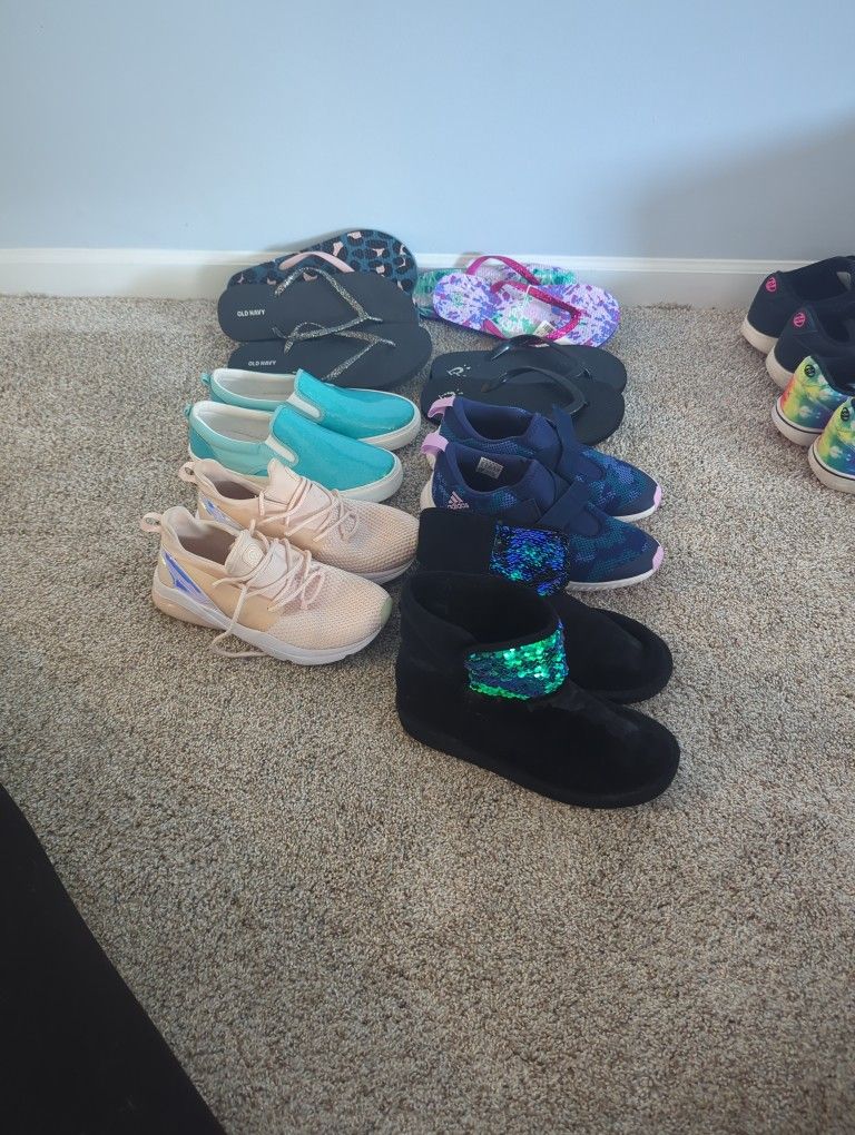 A Bag Of Girls Shoes Size 4