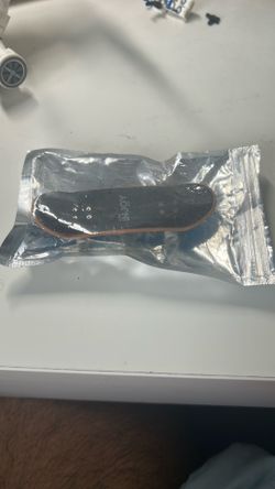Tec dek (finger skateboard) with adjusting tool