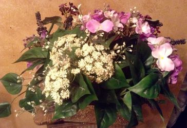 Lavender Floral basket With Babies Breath In Gold Basket