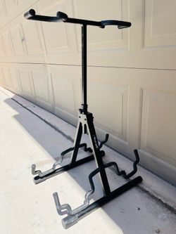 Guitar stand holds two guitars