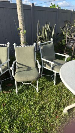 Outdoor fiberglass table with aluminum chairs w/ cushions